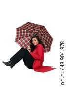 Woman blown over with her umbrella. Стоковое фото, агентство Ingram Publishing / Фотобанк Лори