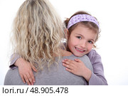 Young girl hugging her mother. Стоковое фото, агентство Ingram Publishing / Фотобанк Лори