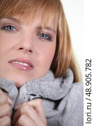 Woman in makeup and a snug grey hooded sweatshirt. Стоковое фото, агентство Ingram Publishing / Фотобанк Лори