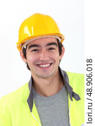Cheerful young construction worker. Стоковое фото, агентство Ingram Publishing / Фотобанк Лори