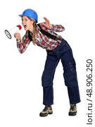 Woman shouting into a loudspeaker. Стоковое фото, агентство Ingram Publishing / Фотобанк Лори