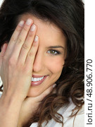 Woman covering an eye with her hand. Стоковое фото, агентство Ingram Publishing / Фотобанк Лори