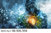 A person exuding an aura of ice and fire holds a glowing orb surrounded by green leaves, symbolizing a fusion of natures elements. Стоковое AI-изображение, AI-художник Данила Большаков / Фотобанк Лори