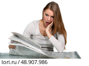 A young woman astonished at the news. Редакционное фото, агентство Ingram Publishing / Фотобанк Лори