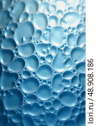 Textural patterns emerge from the surface of corrugated glass, where bubbles form and refract light, creating an atmospheric ambiance. The play of colors evokes tranquility Generative AI. Стоковое AI-изображение, AI-художник Юлия Петровская / Фотобанк Лори