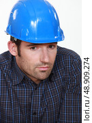 Portrait of tradesman lacking self-confidence. Стоковое фото, агентство Ingram Publishing / Фотобанк Лори
