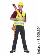 Man wearing a hard hat and holding large clippers. Стоковое фото, агентство Ingram Publishing / Фотобанк Лори