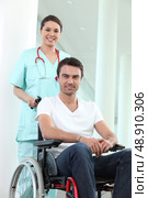 Nurse with disabled man in a wheelchair. Стоковое фото, агентство Ingram Publishing / Фотобанк Лори