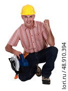 A victorious carpenter. Стоковое фото, агентство Ingram Publishing / Фотобанк Лори