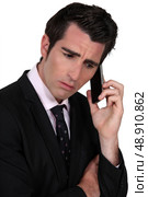 businessman on the phone looking concerned. Стоковое фото, агентство Ingram Publishing / Фотобанк Лори