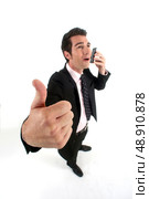successful businessman on the phone with close up on thumb up. Стоковое фото, агентство Ingram Publishing / Фотобанк Лори