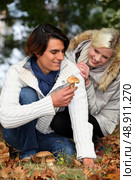 Couple picking mushrooms in the forest. Стоковое фото, агентство Ingram Publishing / Фотобанк Лори