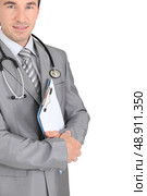 GP with stethoscope and clipboard. Стоковое фото, агентство Ingram Publishing / Фотобанк Лори
