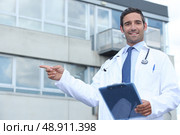 doctor pointing outside. Стоковое фото, агентство Ingram Publishing / Фотобанк Лори