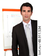 Businessman with a flipchart. Стоковое фото, агентство Ingram Publishing / Фотобанк Лори