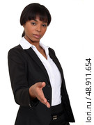 Businesswoman holding hand out. Стоковое фото, агентство Ingram Publishing / Фотобанк Лори