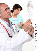 A doctor and a nurse. Стоковое фото, агентство Ingram Publishing / Фотобанк Лори