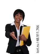 black businesswoman holding filer. Стоковое фото, агентство Ingram Publishing / Фотобанк Лори