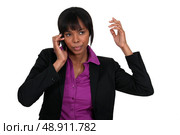 Annoyed businesswoman on the phone. Стоковое фото, агентство Ingram Publishing / Фотобанк Лори