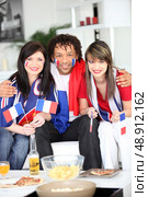 Three French supporters. Стоковое фото, агентство Ingram Publishing / Фотобанк Лори