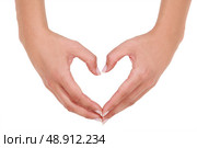 woman making a hearth symbol with her hands. Стоковое фото, агентство Ingram Publishing / Фотобанк Лори
