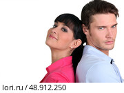 duo standing back to back. Стоковое фото, агентство Ingram Publishing / Фотобанк Лори