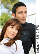 Serious couple sitting outside. Стоковое фото, агентство Ingram Publishing / Фотобанк Лори
