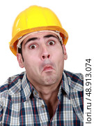 craftsman making a funny face. Стоковое фото, агентство Ingram Publishing / Фотобанк Лори