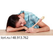 Woman with a brush sleeping on a desk. Стоковое фото, агентство Ingram Publishing / Фотобанк Лори