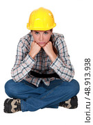 Gloomy female construction worker. Стоковое фото, агентство Ingram Publishing / Фотобанк Лори