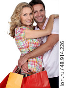 Cuddle with shopping bags. Стоковое фото, агентство Ingram Publishing / Фотобанк Лори