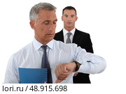 Two businessmen rushing to meet dead-line. Стоковое фото, агентство Ingram Publishing / Фотобанк Лори