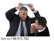 Angry boss hitting employee. Стоковое фото, агентство Ingram Publishing / Фотобанк Лори