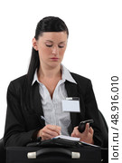 Female reporter wearing visitors badge. Стоковое фото, агентство Ingram Publishing / Фотобанк Лори