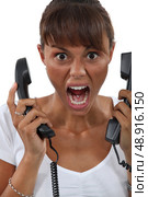 Woman screaming in frustration. Стоковое фото, агентство Ingram Publishing / Фотобанк Лори