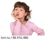 Girl sticking out her tongue. Стоковое фото, агентство Ingram Publishing / Фотобанк Лори