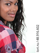 Pretty young woman in a checked shirt. Стоковое фото, агентство Ingram Publishing / Фотобанк Лори