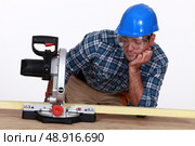Man with a circular saw. Стоковое фото, агентство Ingram Publishing / Фотобанк Лори