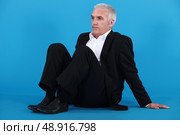 Businessman sitting on the floor. Стоковое фото, агентство Ingram Publishing / Фотобанк Лори