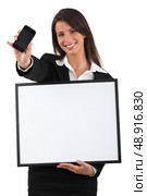Woman with white panel. Стоковое фото, агентство Ingram Publishing / Фотобанк Лори