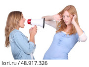 girl shouting through a megaphone. Стоковое фото, агентство Ingram Publishing / Фотобанк Лори