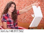 Woman disgusted by her laptop. Стоковое фото, агентство Ingram Publishing / Фотобанк Лори