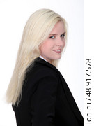 blonde woman wearing a dressy black suit. Стоковое фото, агентство Ingram Publishing / Фотобанк Лори