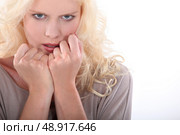 blond woman looking nervous. Стоковое фото, агентство Ingram Publishing / Фотобанк Лори
