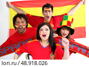 A group of people show their support of the Spanish football team. Стоковое фото, агентство Ingram Publishing / Фотобанк Лори