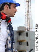 A construction worker on a building site. Стоковое фото, агентство Ingram Publishing / Фотобанк Лори
