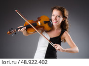 Woman artist with violin in music concept. Стоковое фото, агентство Ingram Publishing / Фотобанк Лори
