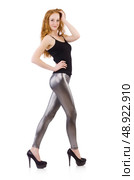 Young redhead girl in tight leggings. Стоковое фото, агентство Ingram Publishing / Фотобанк Лори