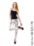 Young redhead girl in tight leggings. Стоковое фото, агентство Ingram Publishing / Фотобанк Лори