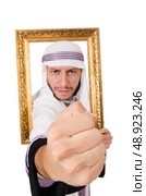 Young arab with picture frame on white. Стоковое фото, агентство Ingram Publishing / Фотобанк Лори